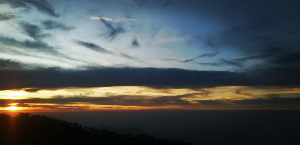 Scenic view of Vattakanal cottages surrounded by misty mountains